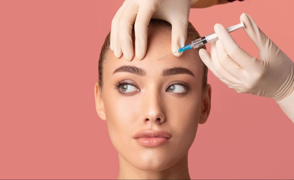 A woman receiving Botox injections for wrinkle reduction and forehead lines treatment.