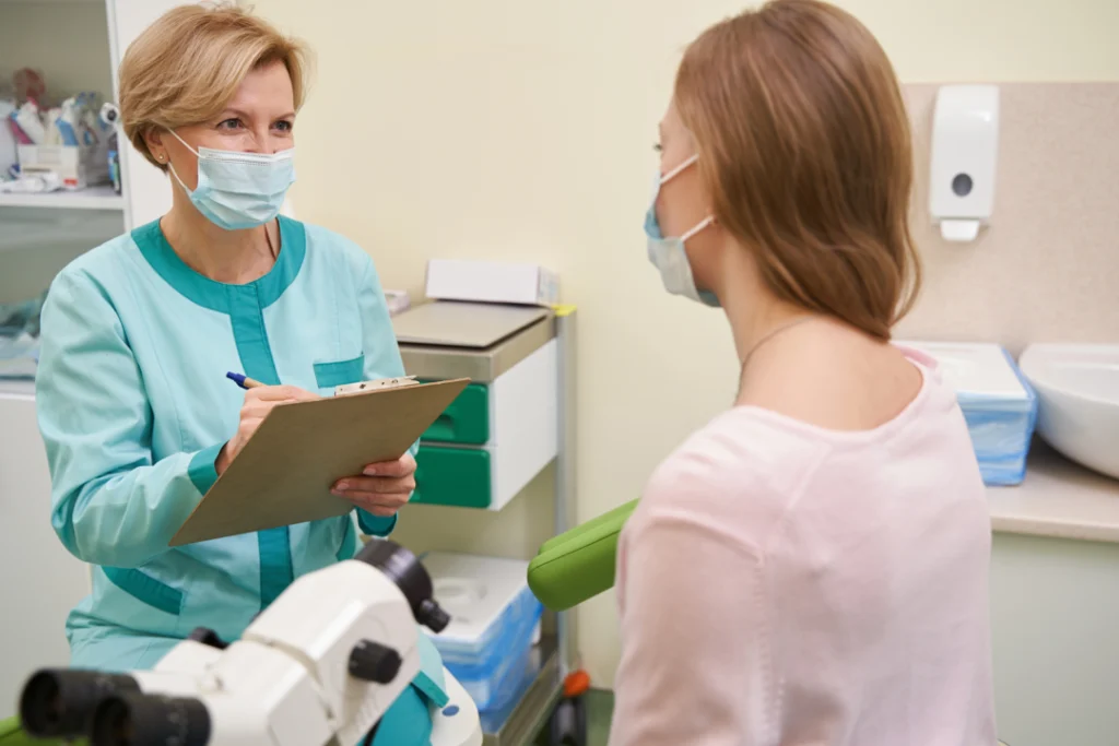 A medical professional discussing treatment options during a personalized aesthetics consultation.