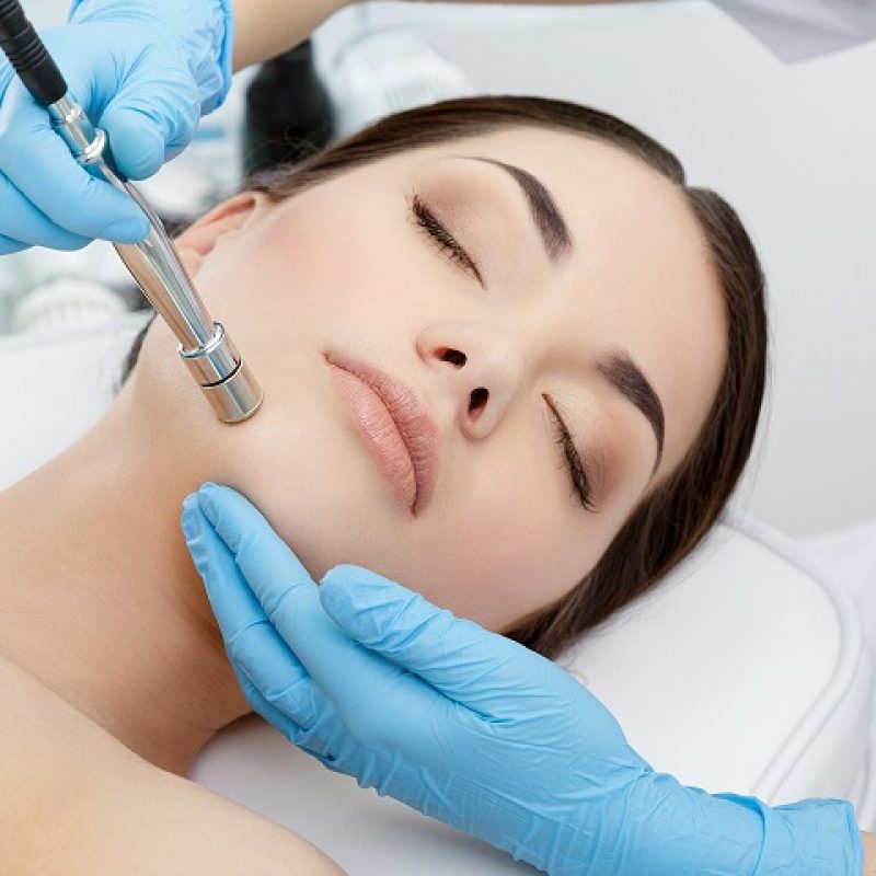 Procedure of Microdermabrasion. Mechanical Exfoliation, diamond polishing. Model, close-up. Cosmetological clinic. Medical equipment. Healthcare, clinic, cosmetology